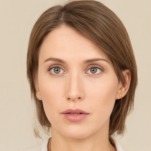 Neutral white young-adult female with medium  brown hair and green eyes