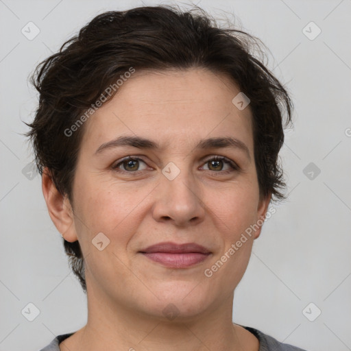 Joyful white adult female with short  brown hair and brown eyes