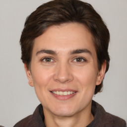 Joyful white young-adult male with medium  brown hair and brown eyes