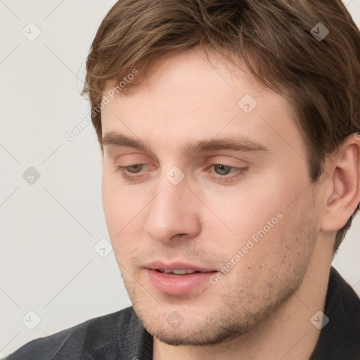 Neutral white young-adult male with short  brown hair and grey eyes