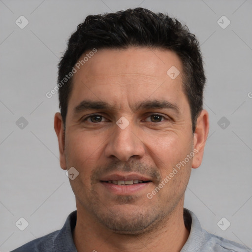 Joyful white adult male with short  black hair and brown eyes