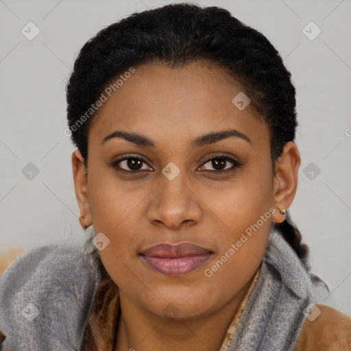 Joyful black young-adult female with short  brown hair and brown eyes