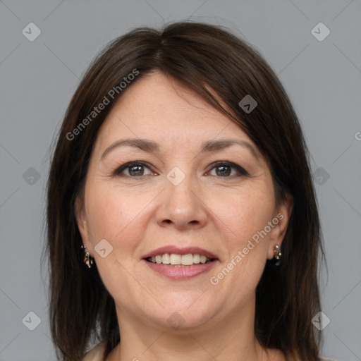 Joyful white adult female with medium  brown hair and grey eyes