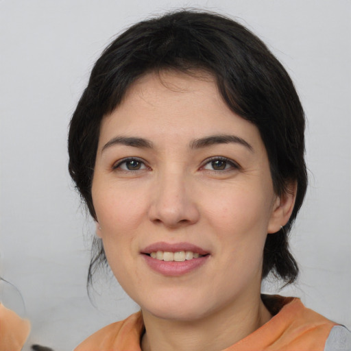 Joyful white young-adult female with medium  brown hair and brown eyes