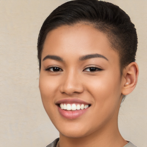 Joyful latino young-adult female with short  brown hair and brown eyes