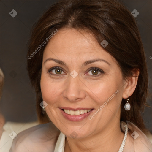 Joyful white adult female with medium  brown hair and brown eyes