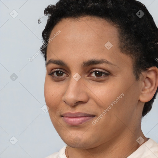 Joyful latino young-adult female with short  brown hair and brown eyes