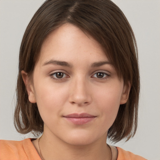 Neutral white young-adult female with medium  brown hair and brown eyes