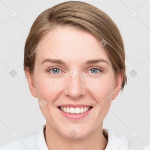 Joyful white young-adult female with medium  brown hair and blue eyes