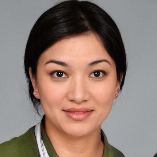 Joyful latino young-adult female with medium  black hair and brown eyes