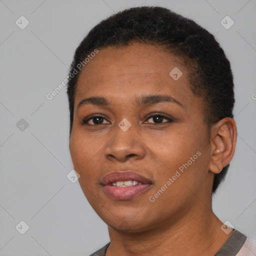 Joyful black young-adult female with short  black hair and brown eyes