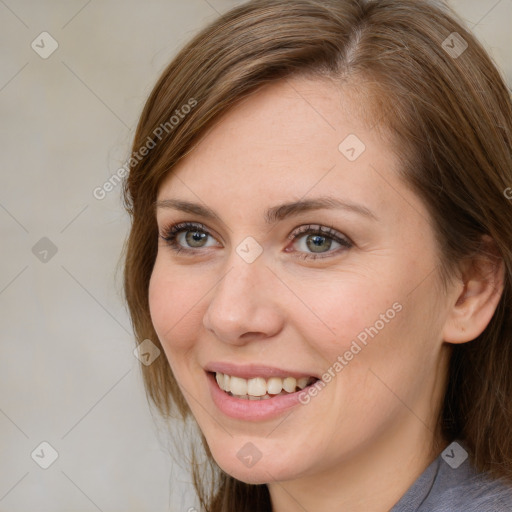 Joyful white young-adult female with medium  brown hair and blue eyes