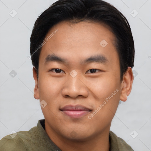 Joyful asian young-adult male with short  brown hair and brown eyes