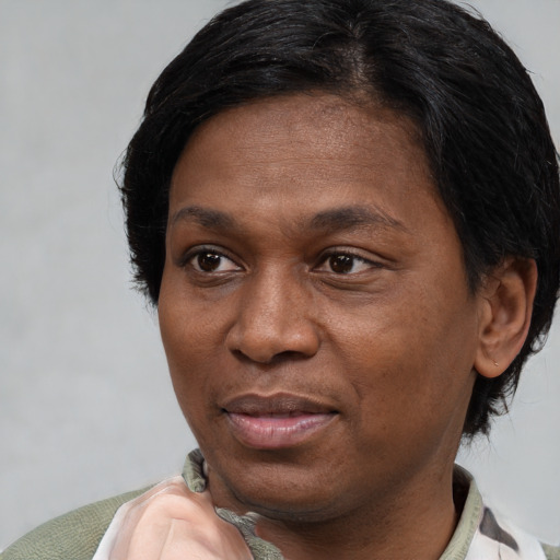 Joyful white adult female with short  brown hair and brown eyes