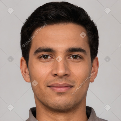 Joyful white young-adult male with short  black hair and brown eyes