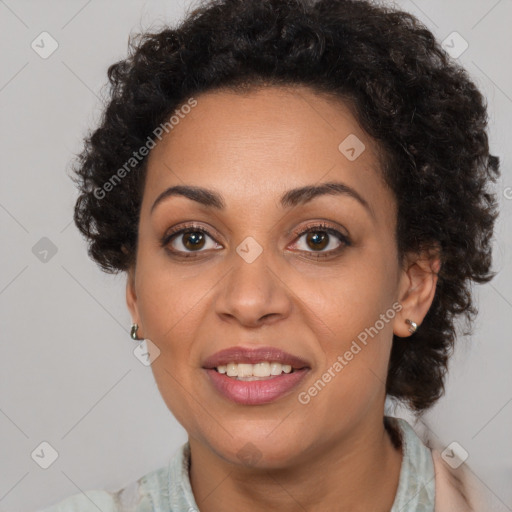 Joyful black adult female with medium  brown hair and brown eyes