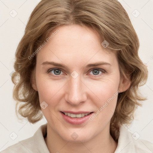 Joyful white young-adult female with medium  brown hair and blue eyes