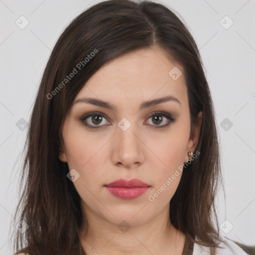 Neutral white young-adult female with long  brown hair and brown eyes