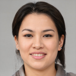 Joyful white young-adult female with medium  brown hair and brown eyes