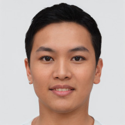 Joyful asian young-adult male with short  black hair and brown eyes