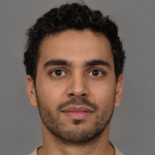 Neutral latino young-adult male with short  brown hair and brown eyes
