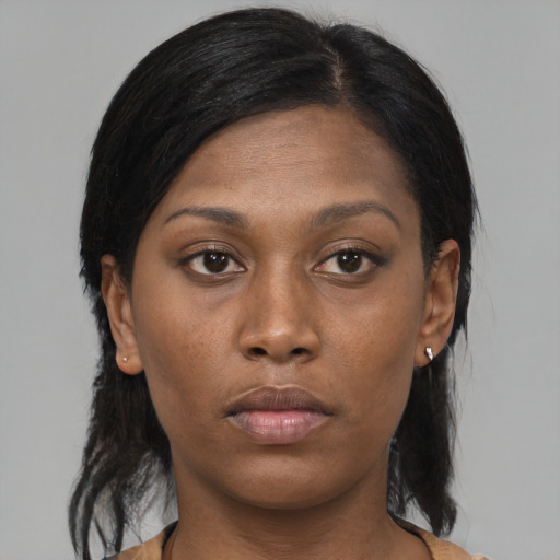 Neutral black young-adult female with medium  brown hair and brown eyes
