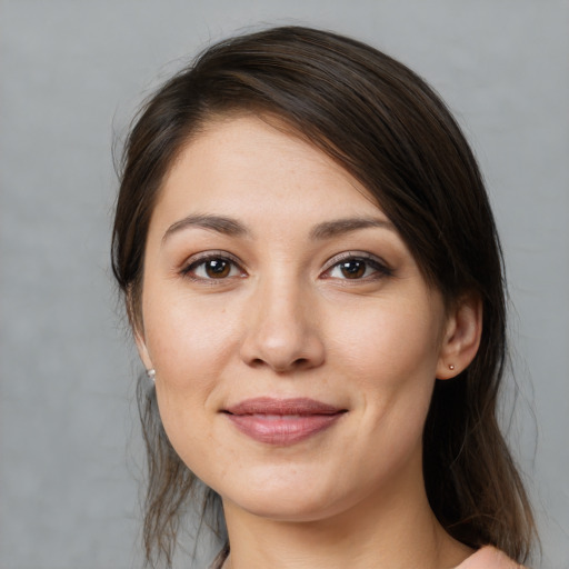 Joyful white young-adult female with medium  brown hair and brown eyes