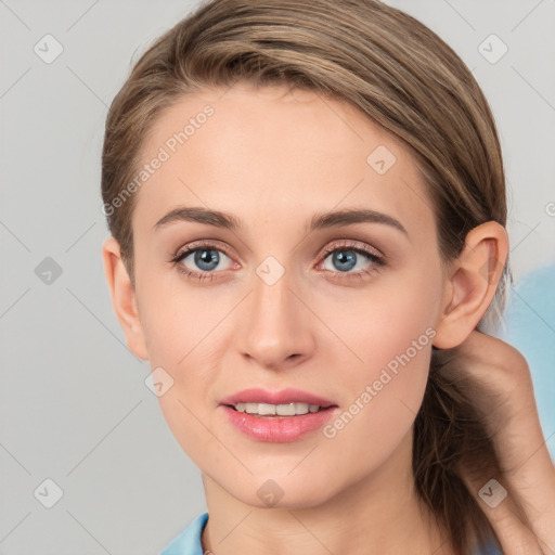 Joyful white young-adult female with medium  brown hair and blue eyes