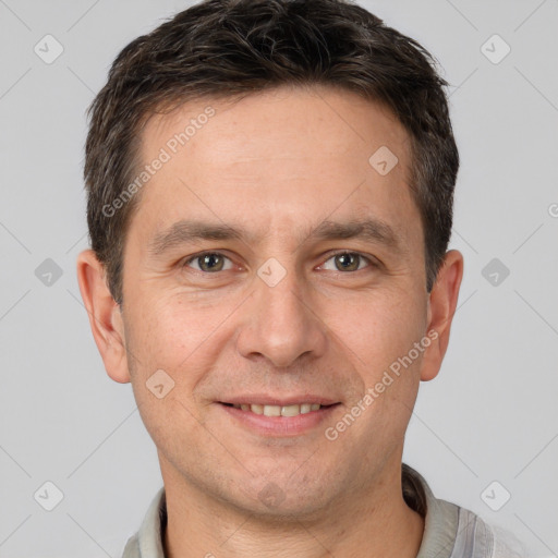 Joyful white adult male with short  brown hair and brown eyes