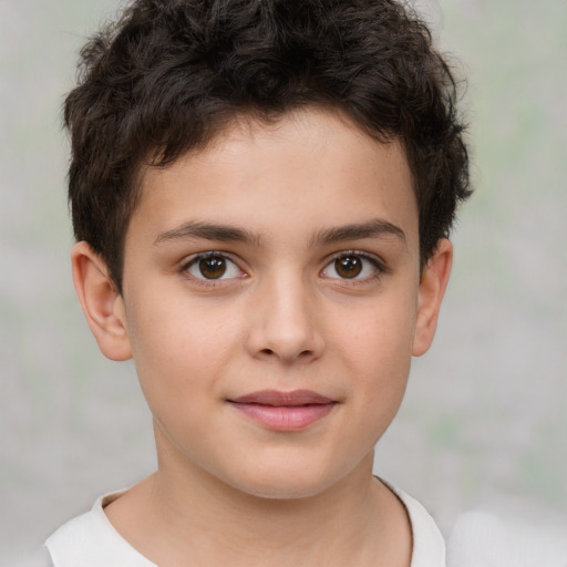 Joyful white child male with short  brown hair and brown eyes