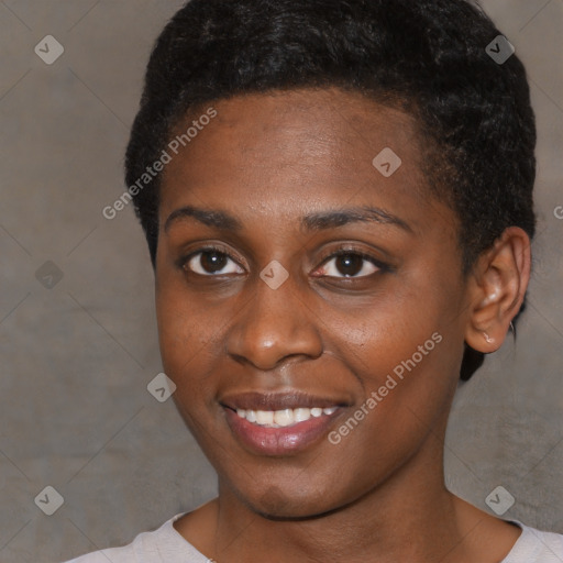 Joyful black young-adult female with short  black hair and brown eyes