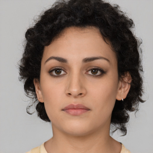 Neutral latino young-adult female with medium  brown hair and brown eyes