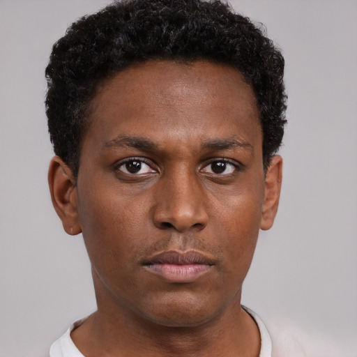 Neutral black young-adult male with short  brown hair and brown eyes