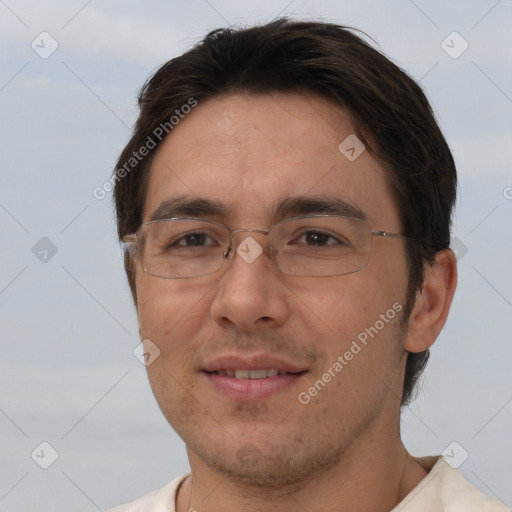 Joyful white adult male with short  brown hair and brown eyes