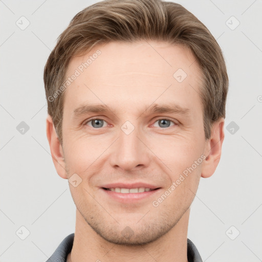 Joyful white young-adult male with short  brown hair and grey eyes