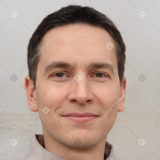 Joyful white adult male with short  brown hair and brown eyes