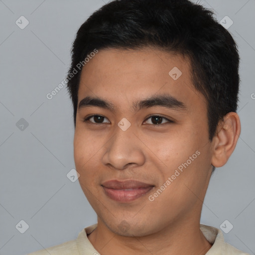 Joyful asian young-adult male with short  black hair and brown eyes