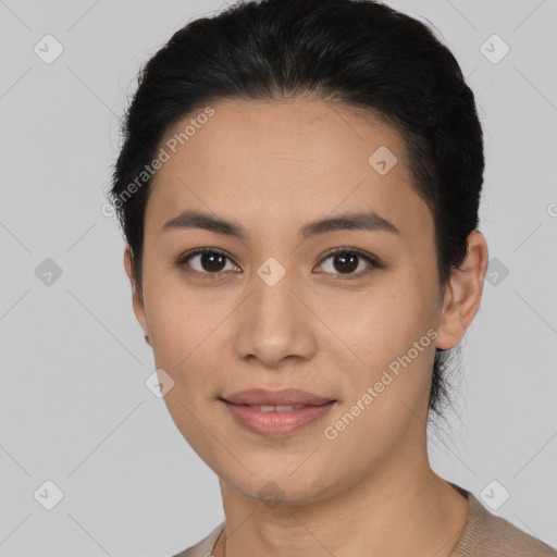 Joyful latino young-adult female with short  brown hair and brown eyes