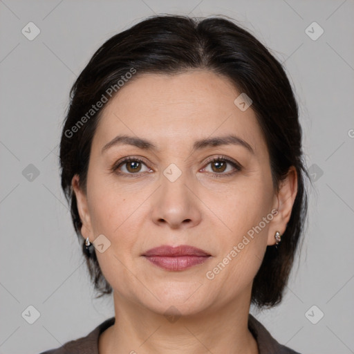 Joyful white adult female with medium  brown hair and brown eyes