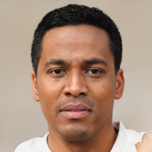 Neutral black young-adult male with short  black hair and brown eyes