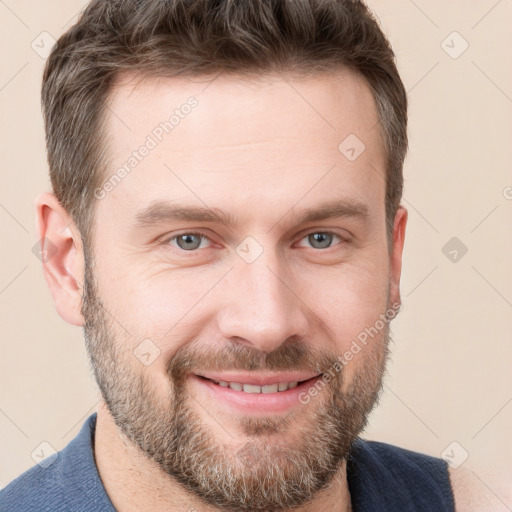 Joyful white adult male with short  brown hair and grey eyes