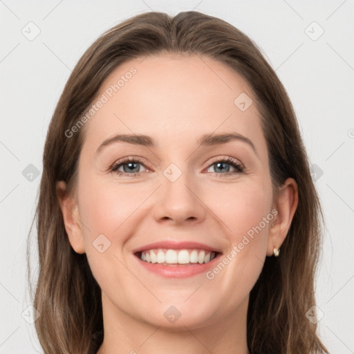 Joyful white young-adult female with long  brown hair and grey eyes