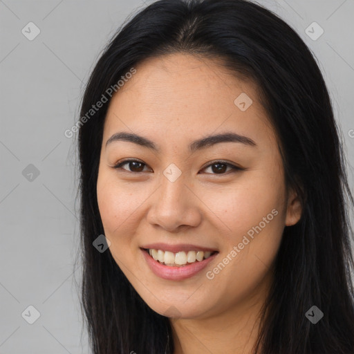 Joyful asian young-adult female with long  brown hair and brown eyes