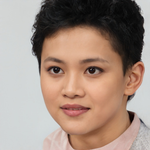 Joyful asian young-adult female with short  brown hair and brown eyes
