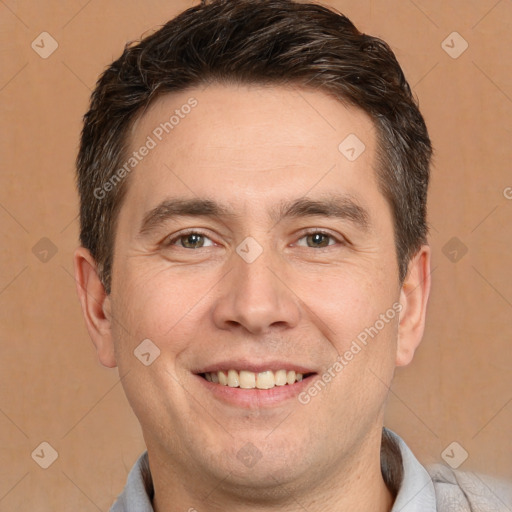 Joyful white adult male with short  brown hair and brown eyes