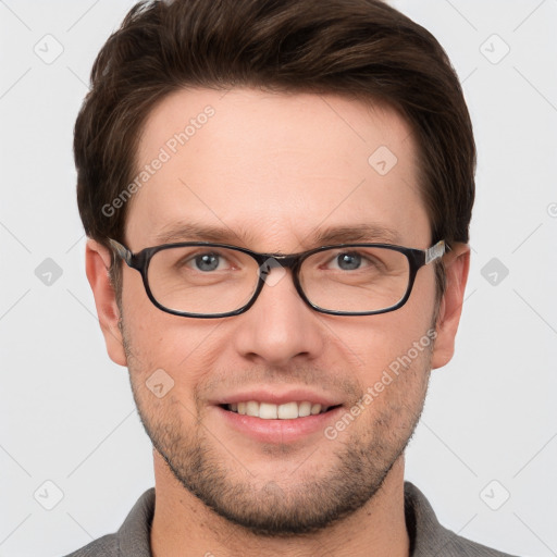 Joyful white young-adult male with short  brown hair and grey eyes