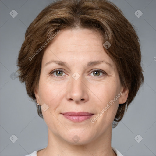 Joyful white adult female with medium  brown hair and grey eyes