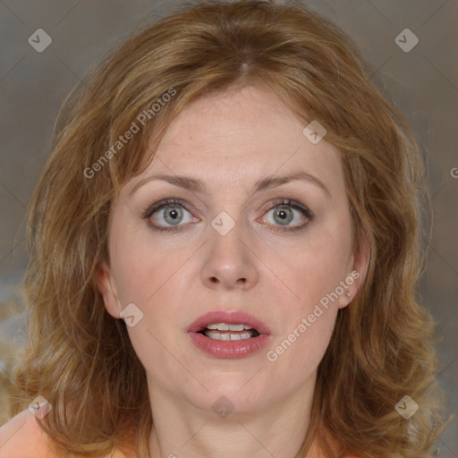 Joyful white adult female with medium  brown hair and blue eyes