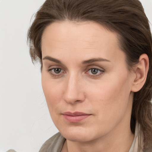 Neutral white young-adult female with medium  brown hair and grey eyes