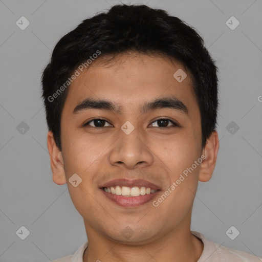 Joyful latino young-adult male with short  black hair and brown eyes